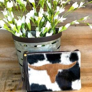 Hide and leather! Cosmetic bag, jewelry pouch, credit card/money pouch! Classy!